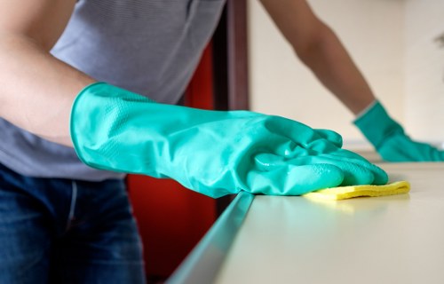 Trained carpet cleaner working safely in Bromley